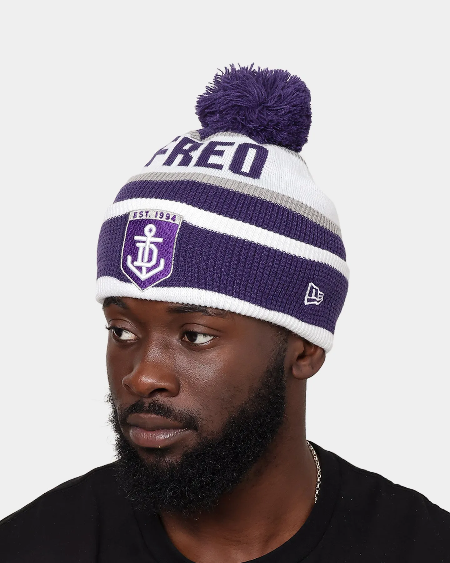 New Era Fremantle Dockers AFL Opening Bounce 2022 Pom Waffle Wordmark Beanie Purple