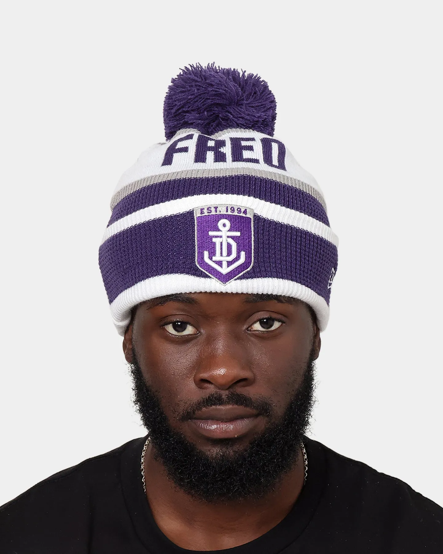 New Era Fremantle Dockers AFL Opening Bounce 2022 Pom Waffle Wordmark Beanie Purple